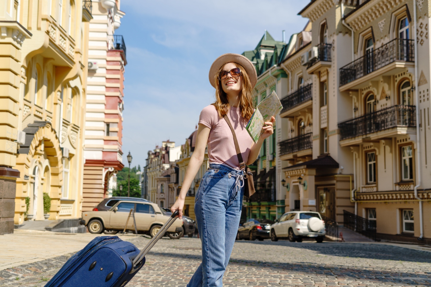 beautiful-young-woman-tourist-pleasant-with-city-map-suitcase-city-center